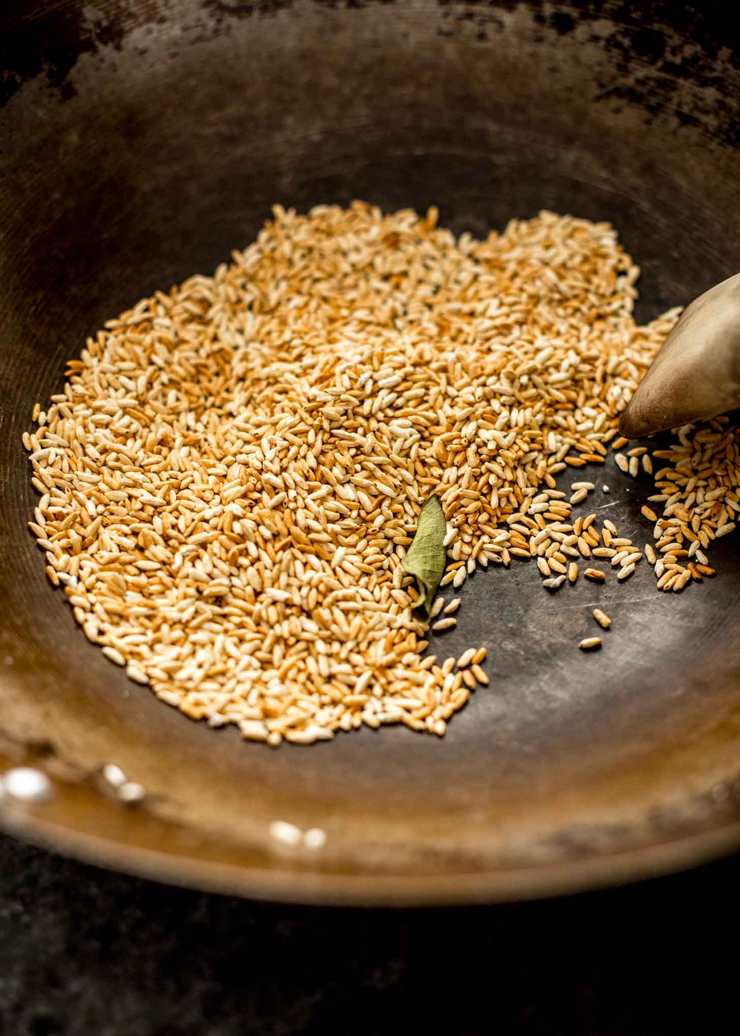 overhead image of toasting rice in wok