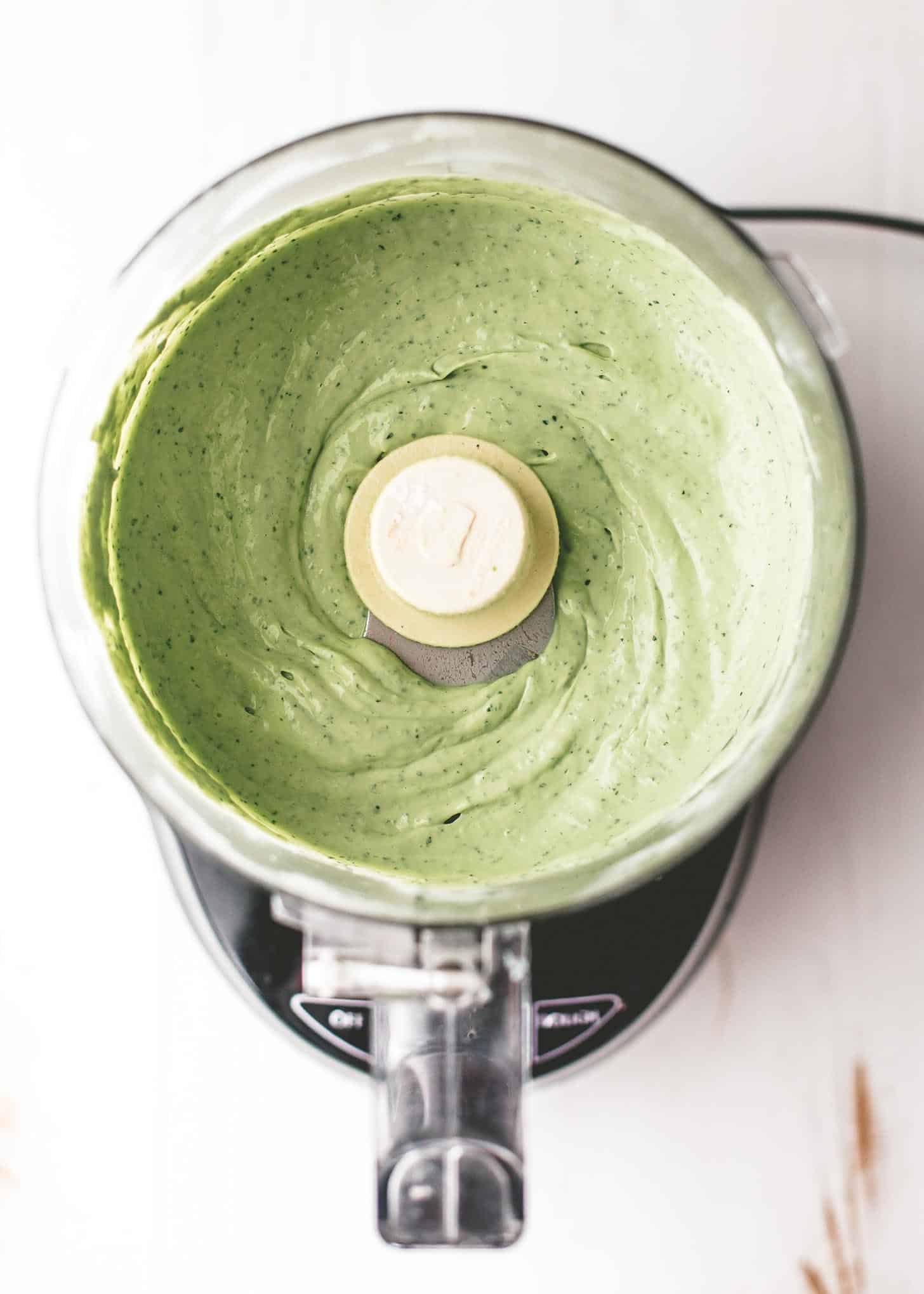 overhead image of avocado crema in a food processor