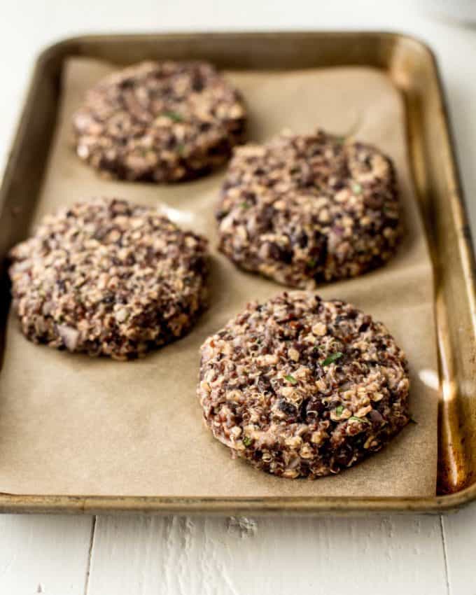 Black Bean and Quinoa Burger patties on a parchment lined sheet pan