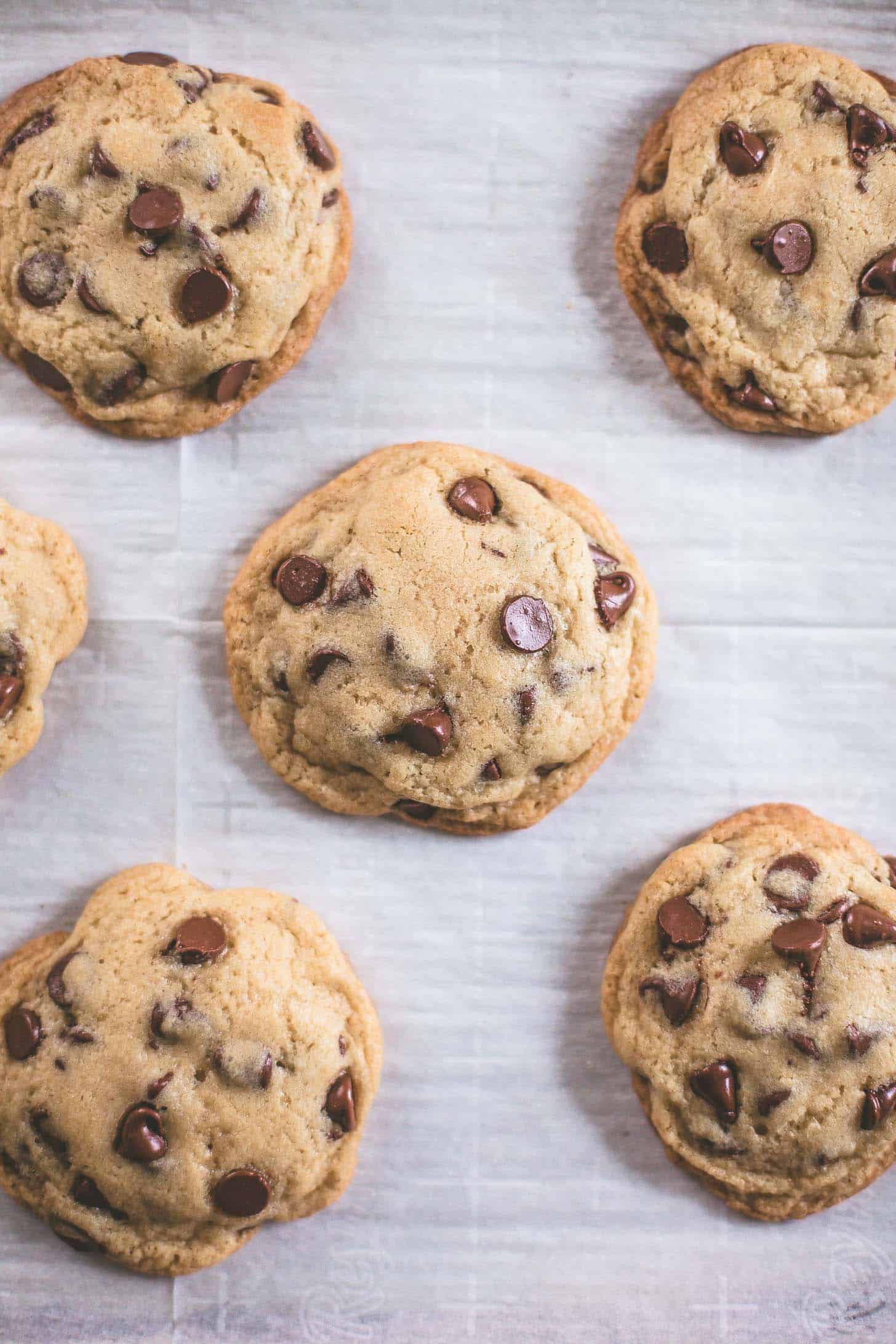 overhead image of chocolate chip cookies on a white background