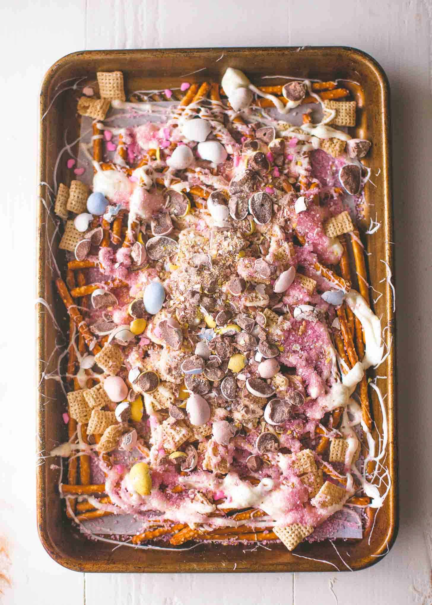 Easter Egg Crunch Bark on a sheet pan lined with parchment paper