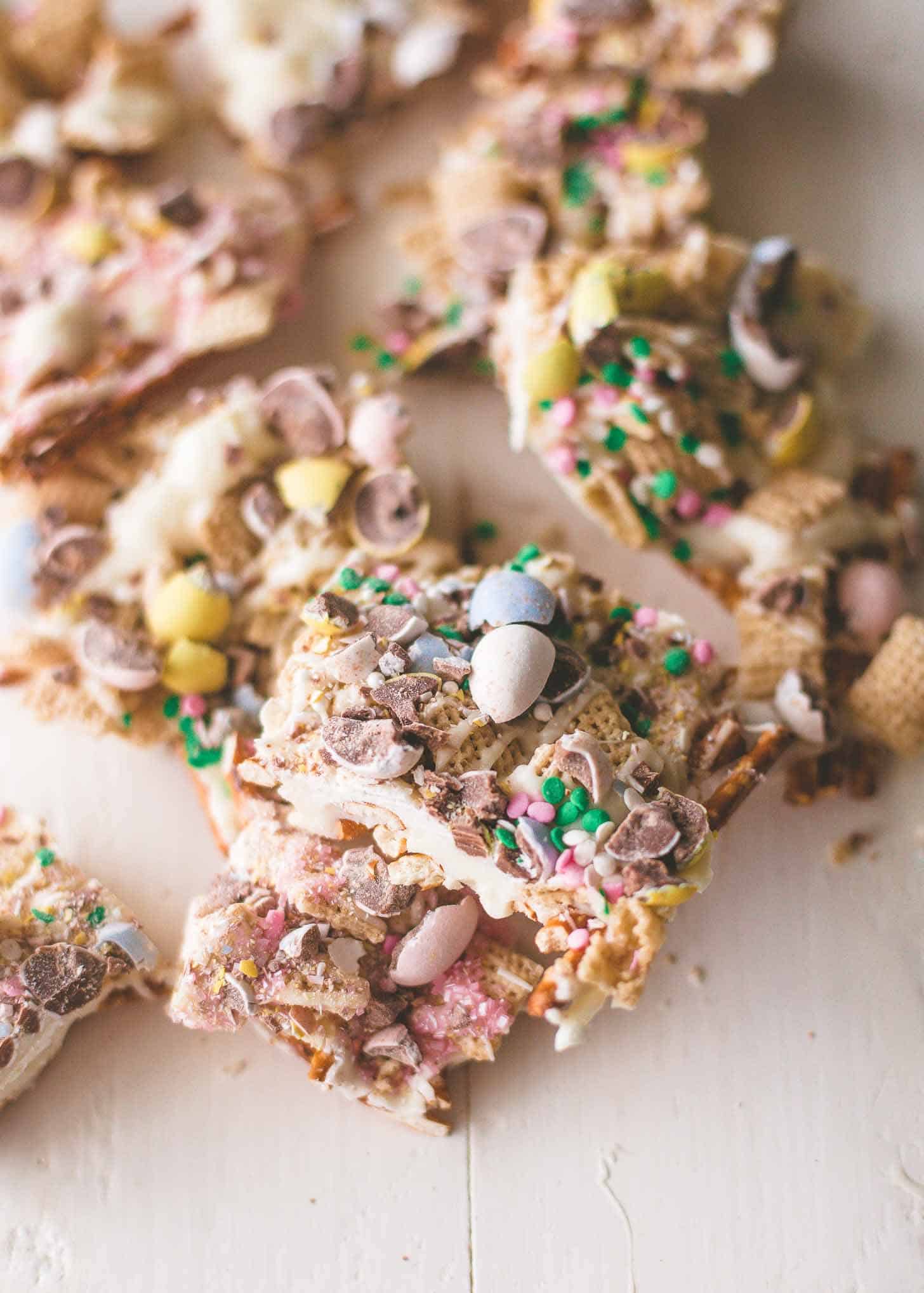Easter Egg Crunch Bark broken into large pieces on a white table