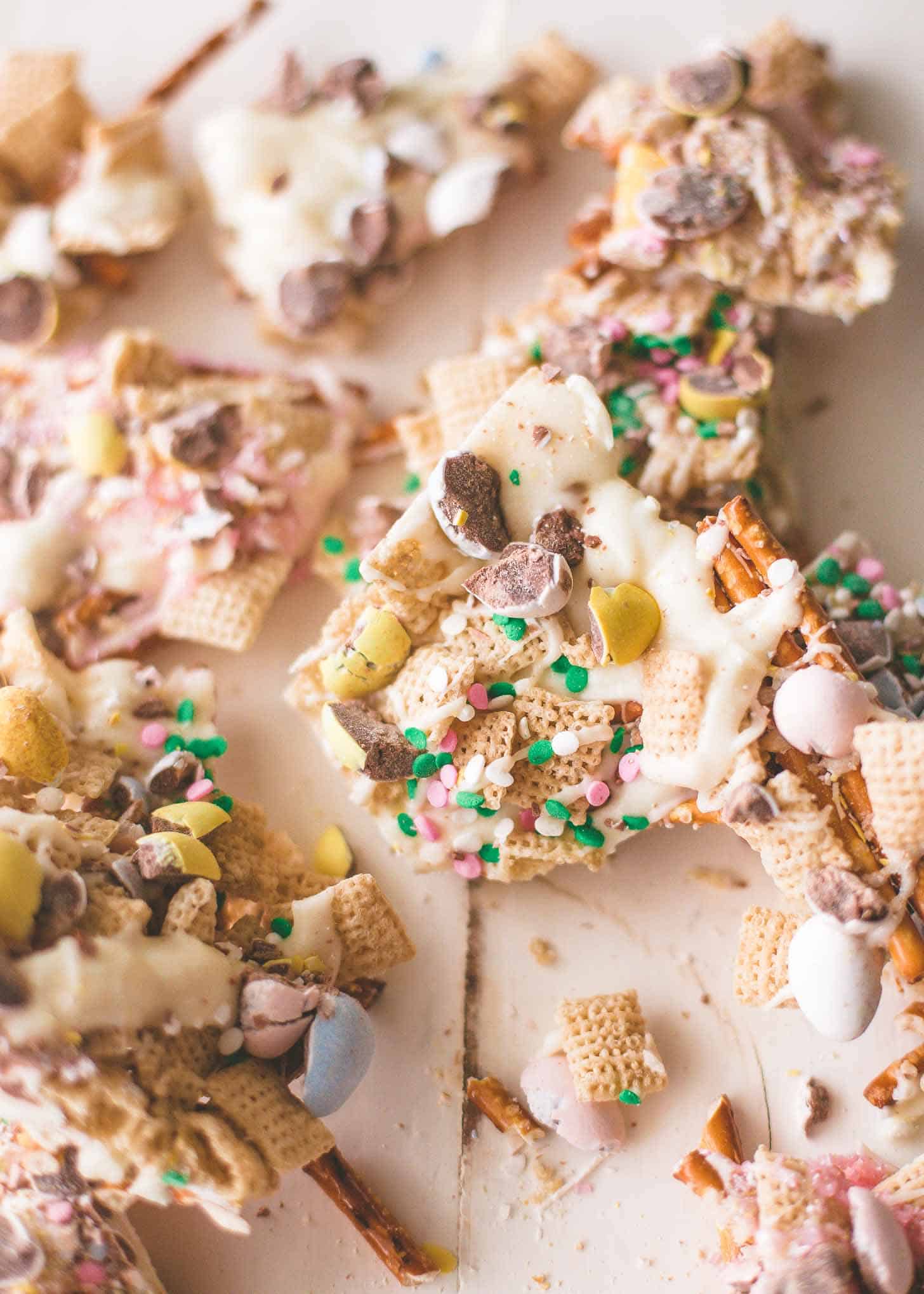Easter Egg Crunch Bark, broken into large pieces on a white table