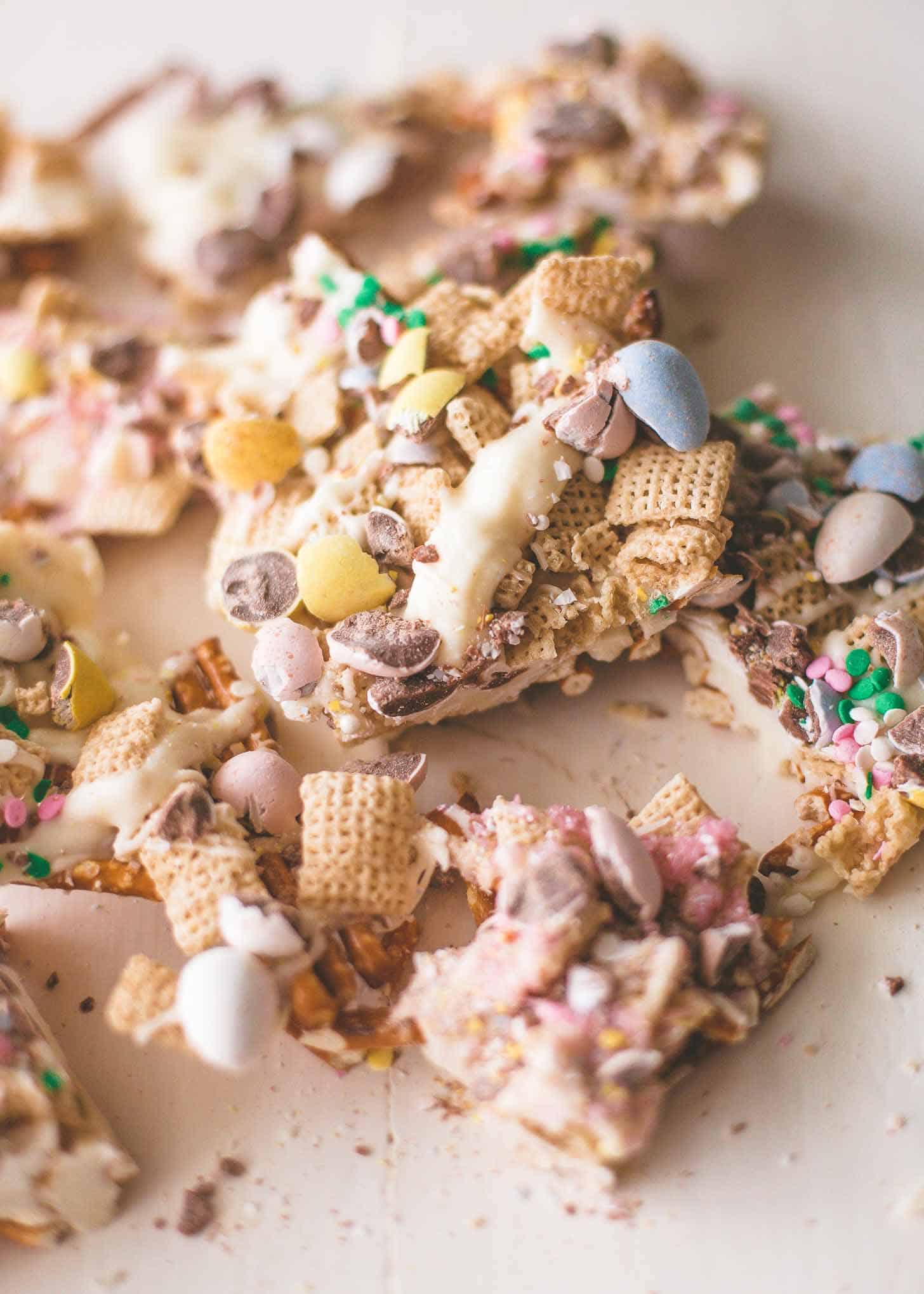 pieces of Easter Egg Crunch Bark on a white table