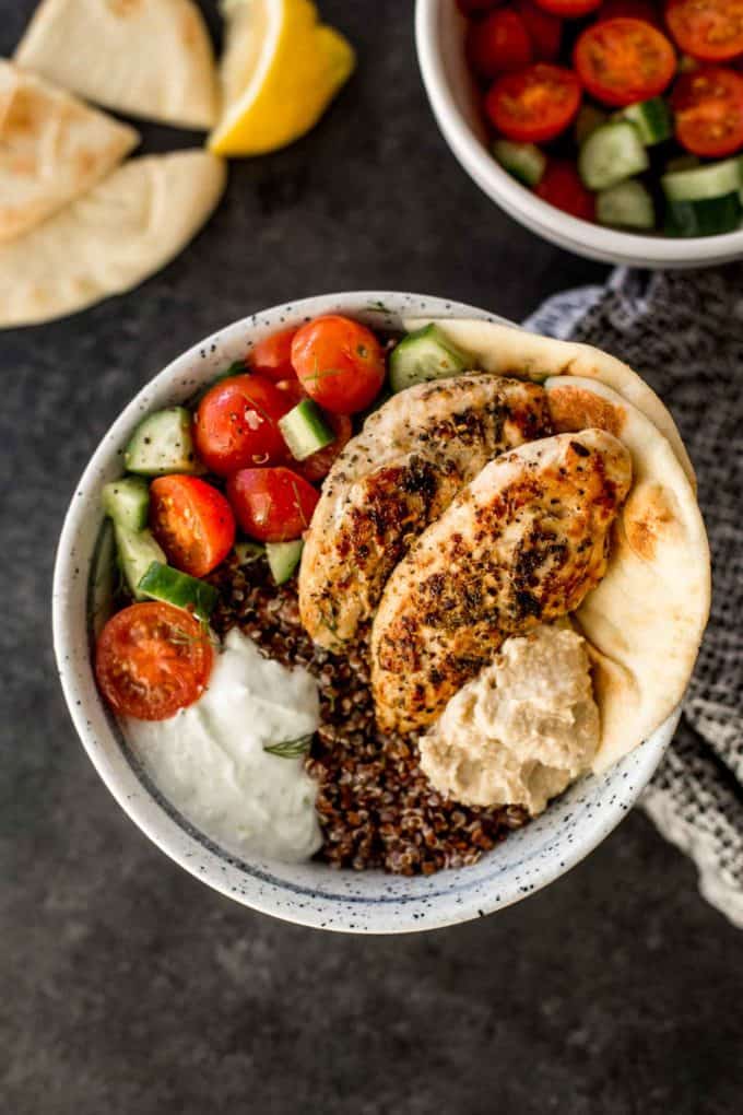 mediterranean chicken quinoa bowl on a grey countertop