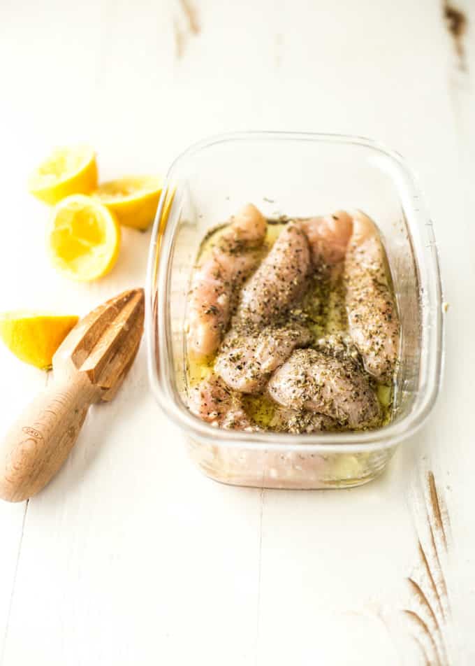 marinating chicken tenderloins in a clear plastic container