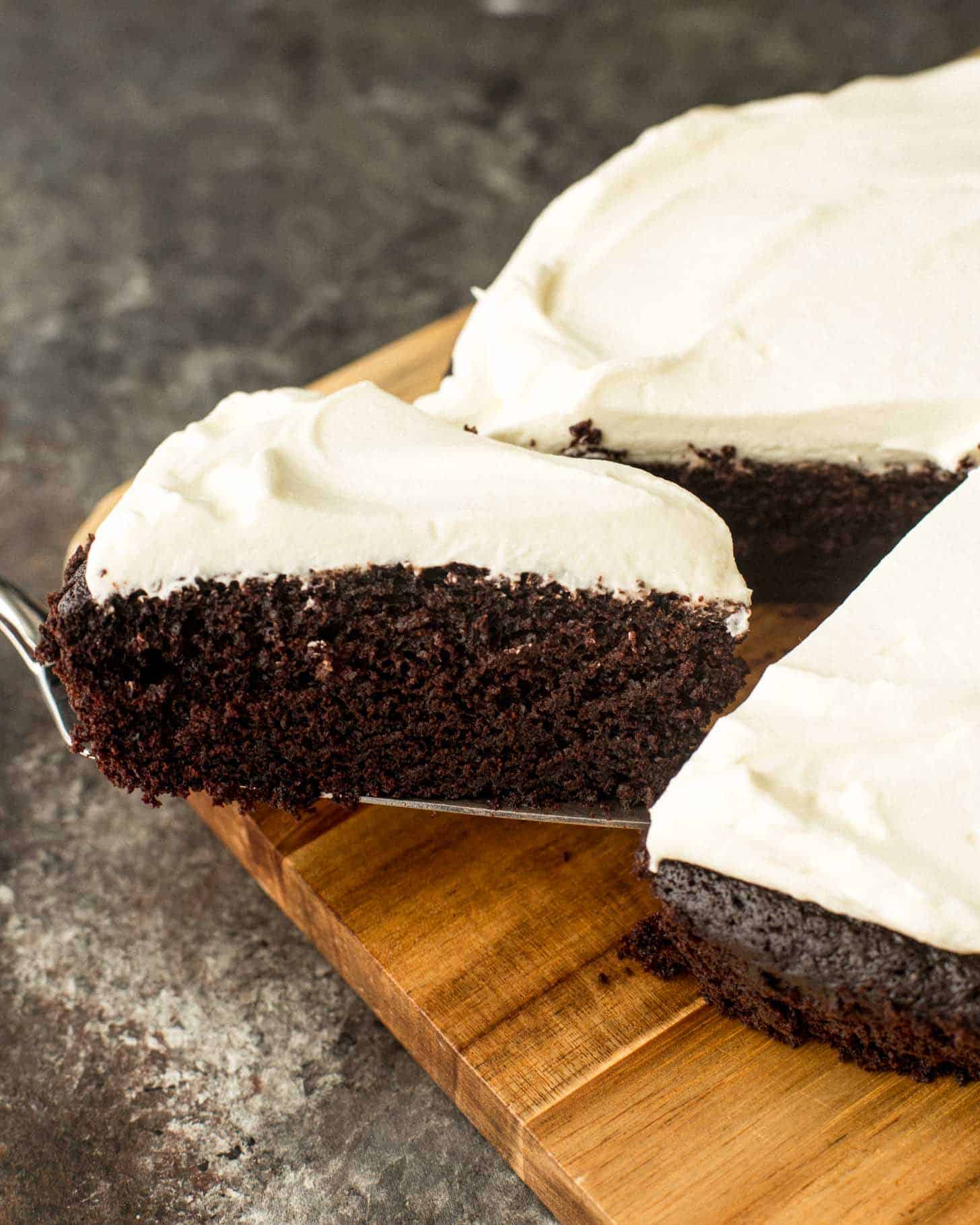 removing a slice of Guinness chocolate cake with a pie server