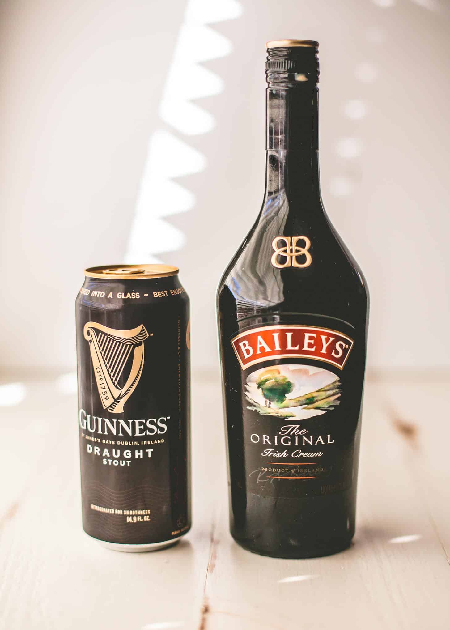 Guinness and Bailey's on a white tabletop