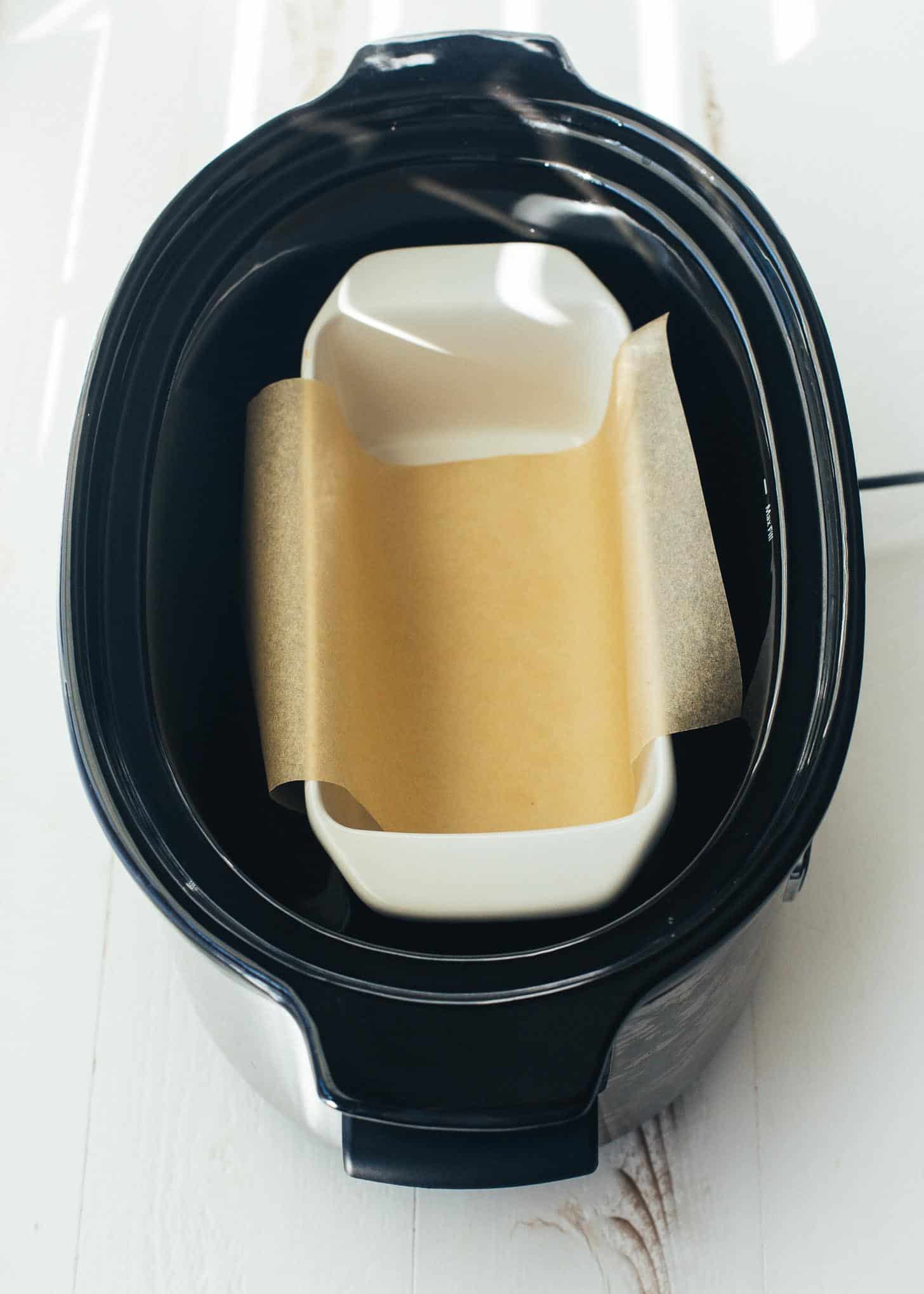 overhead image of a loaf pan in slow cooker