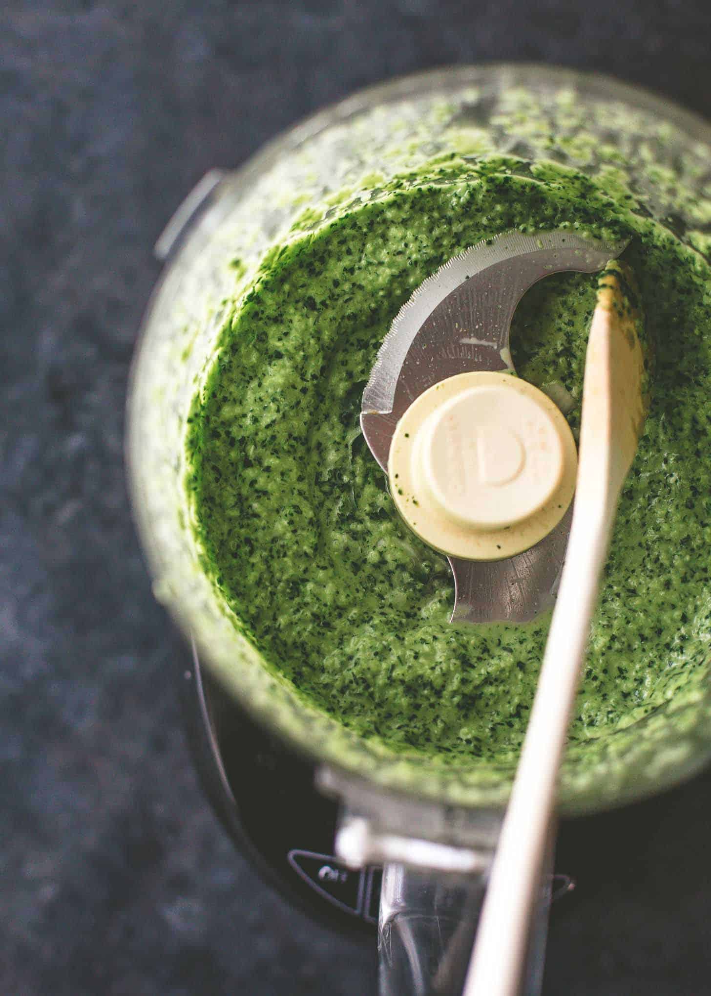 overhead image of herb mix in food processor