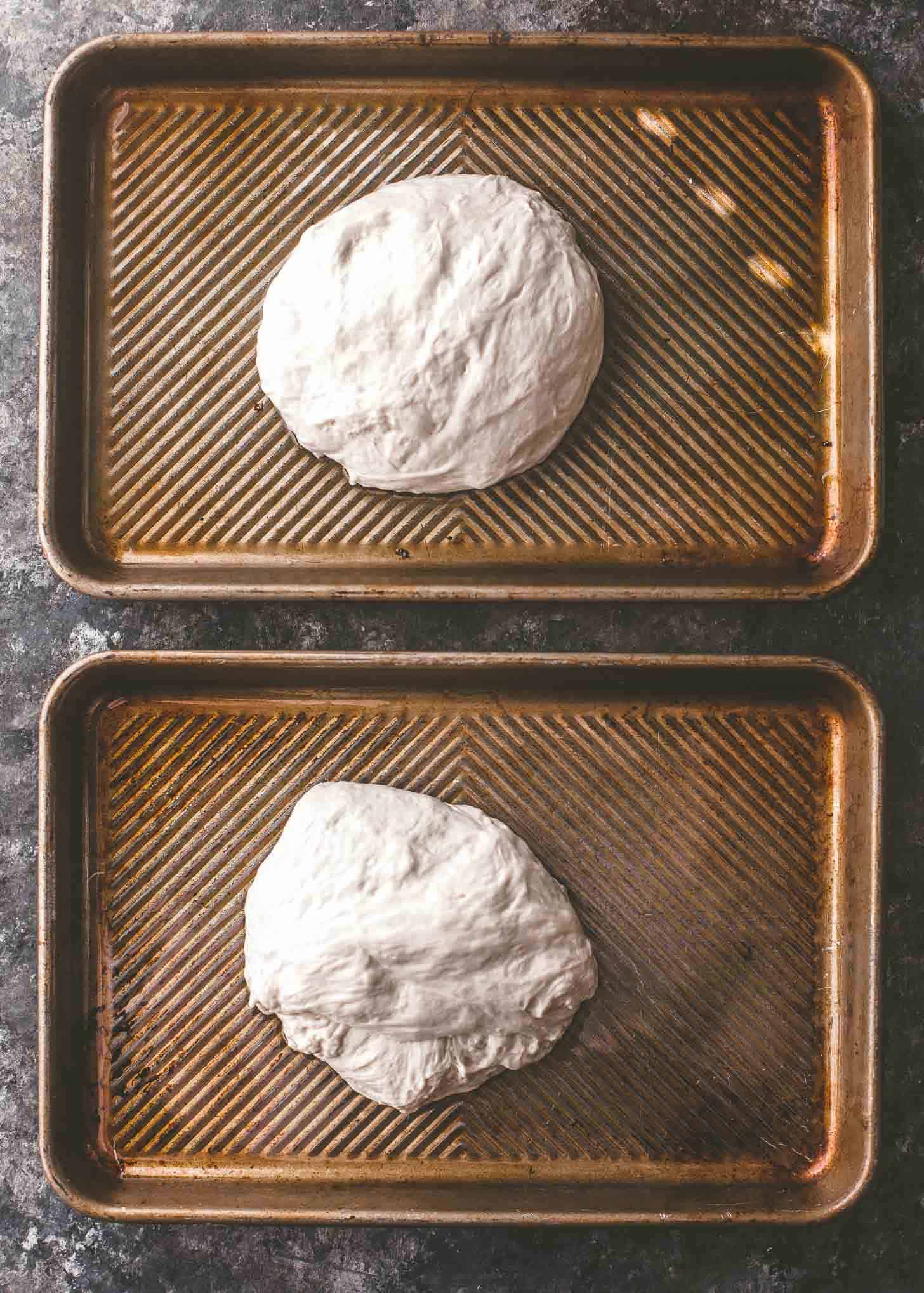 overhead image of pizza dough on oiled sheet pans
