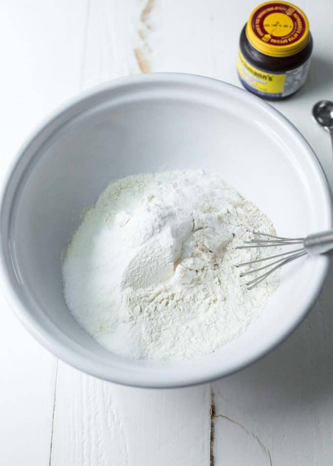 dry ingredients for bread in a white bowl