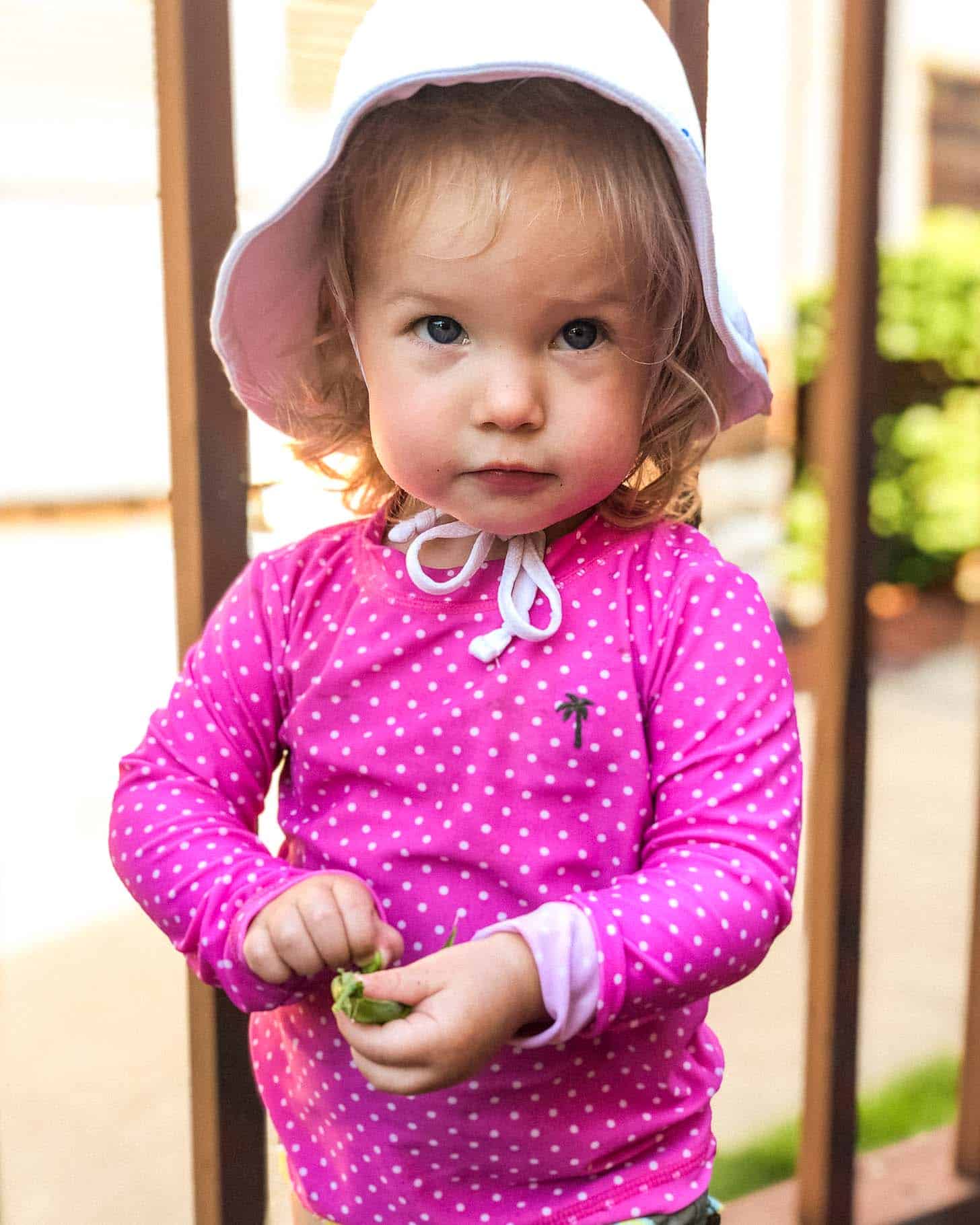 june in a hat outside