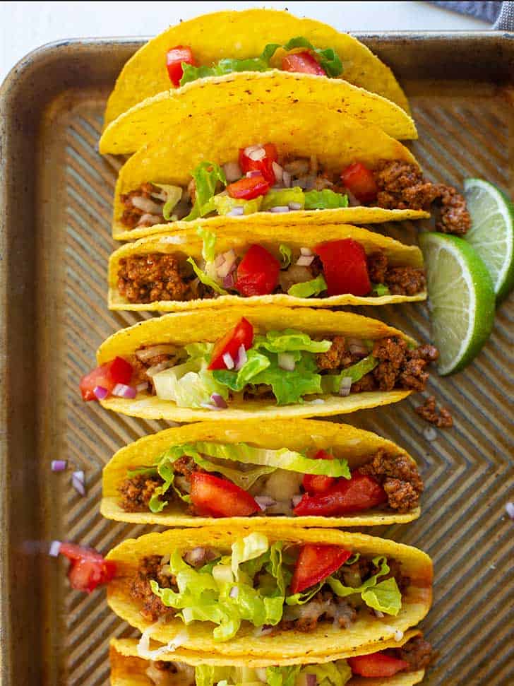 Sheet Pan Tacos on a baking pan with toppings