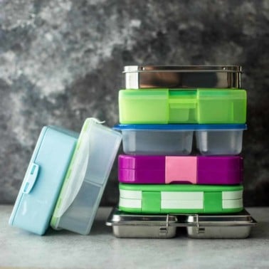 lunchboxes stacked on a table