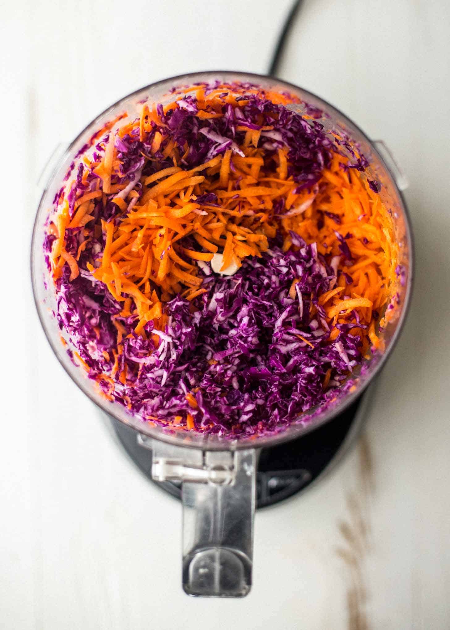 cabbage and carrots in a food processor