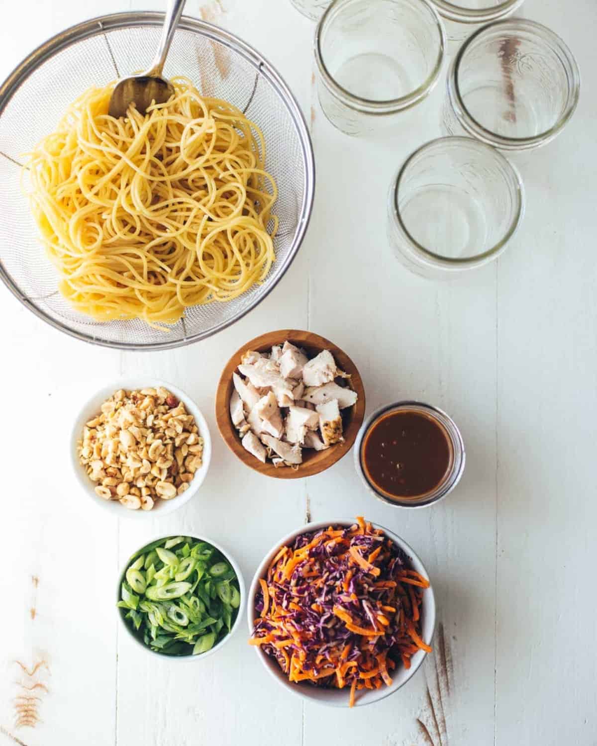Ingredients for Sesame Noodle Salad on a white table