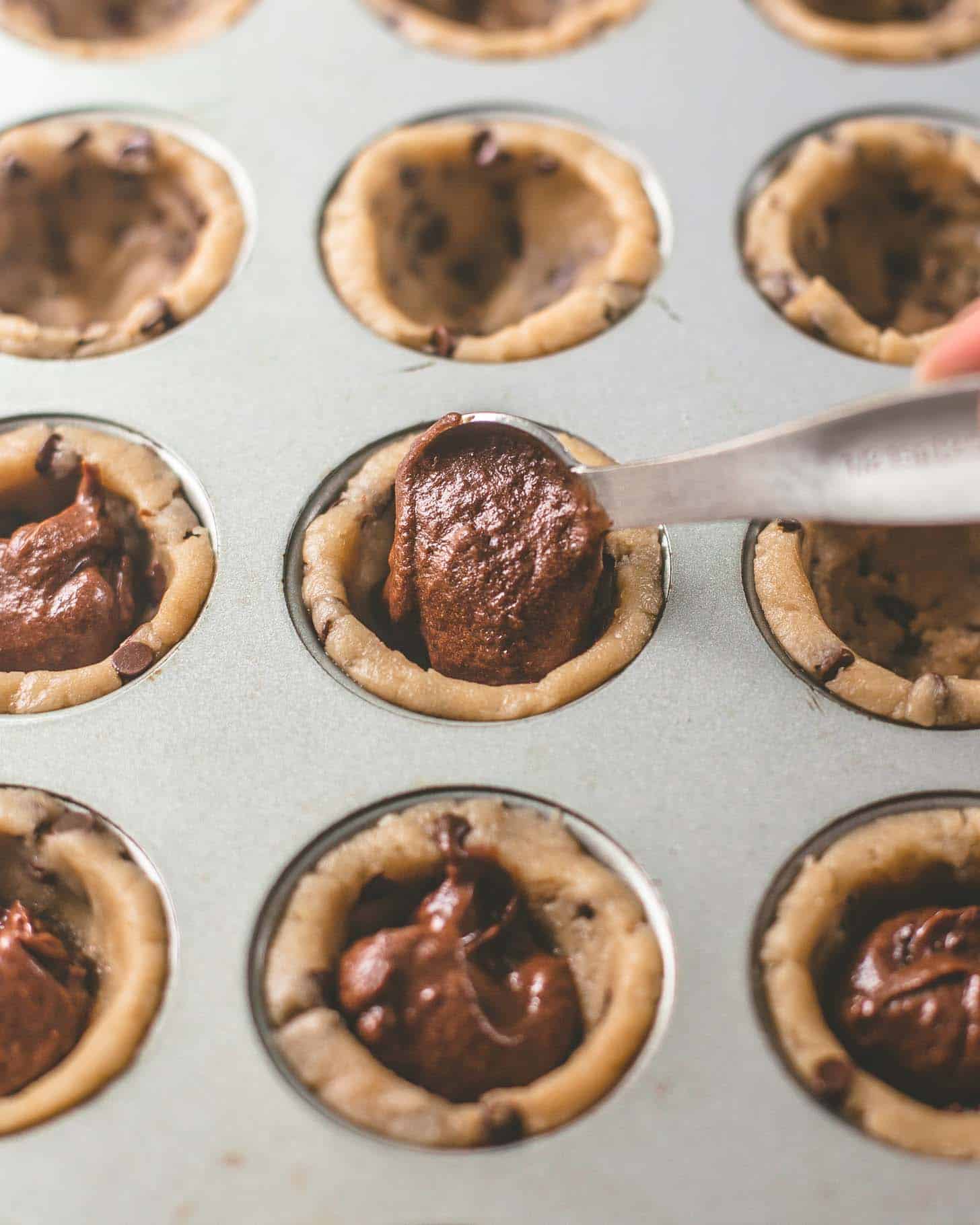 https://inquiringchef.com/wp-content/uploads/2020/07/Chocolate-Chip-Brownie-Tarts-5.jpg