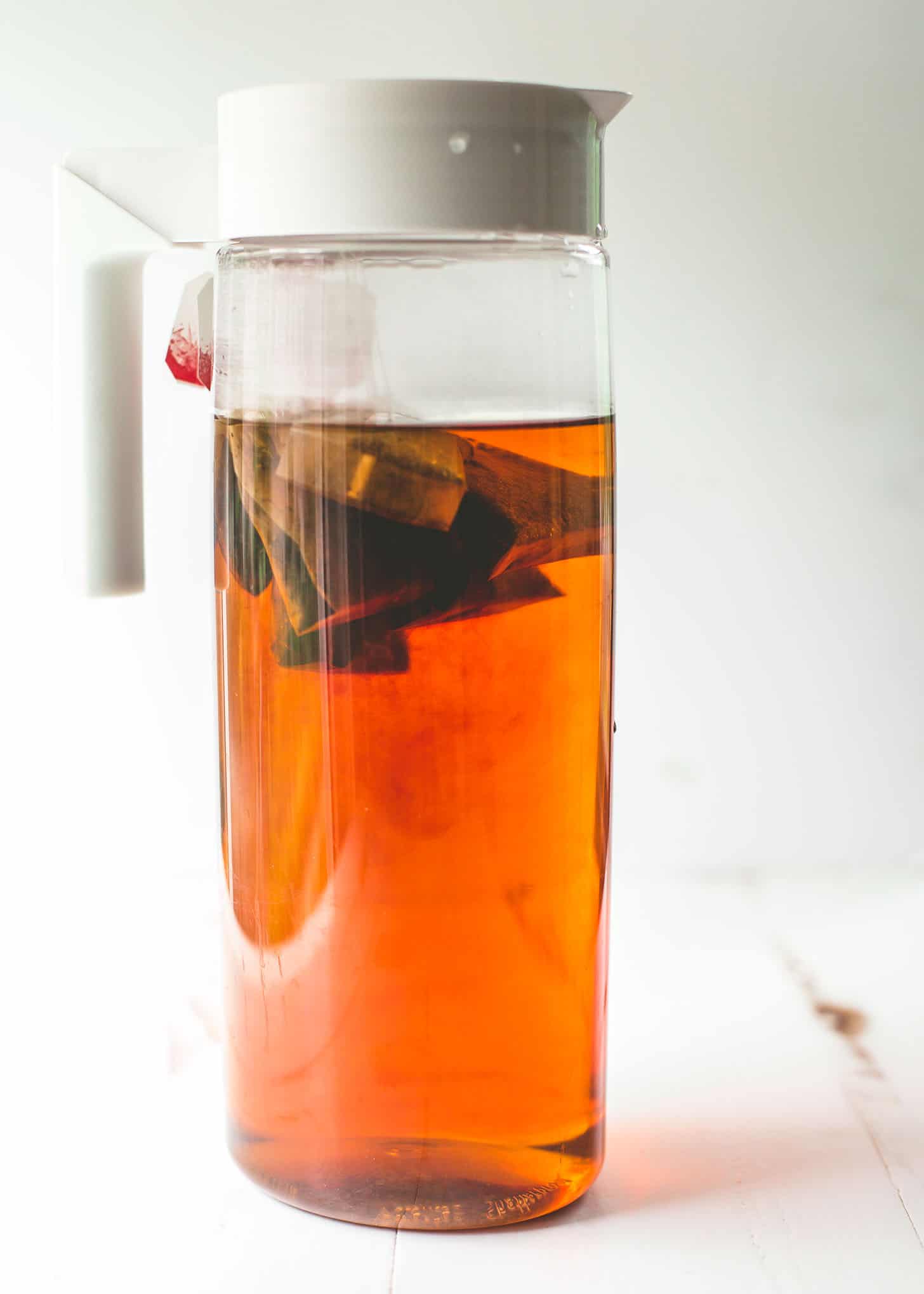 Sweet tea in a pitcher on a white table