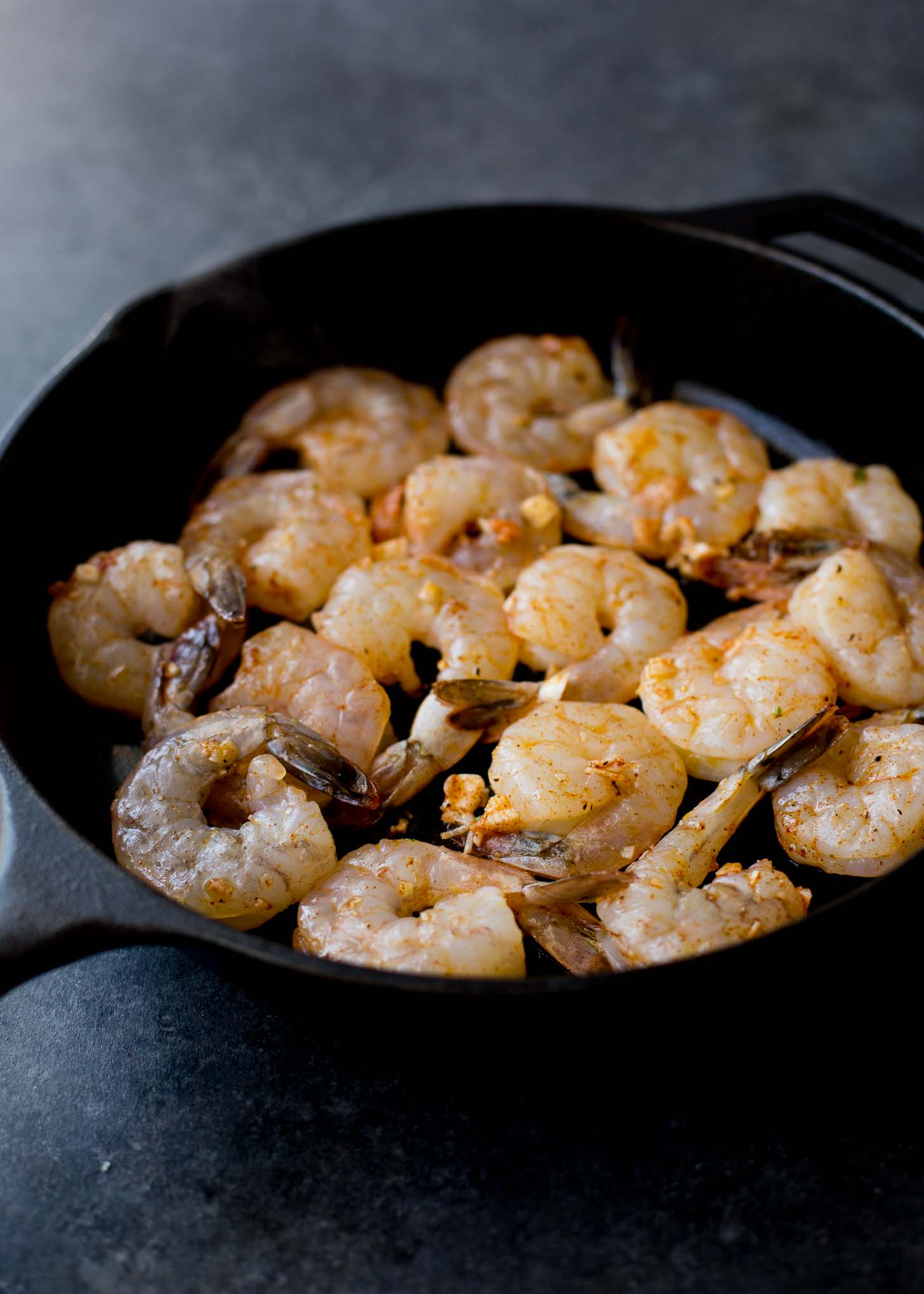 raw shrimp in a cast iron skillet