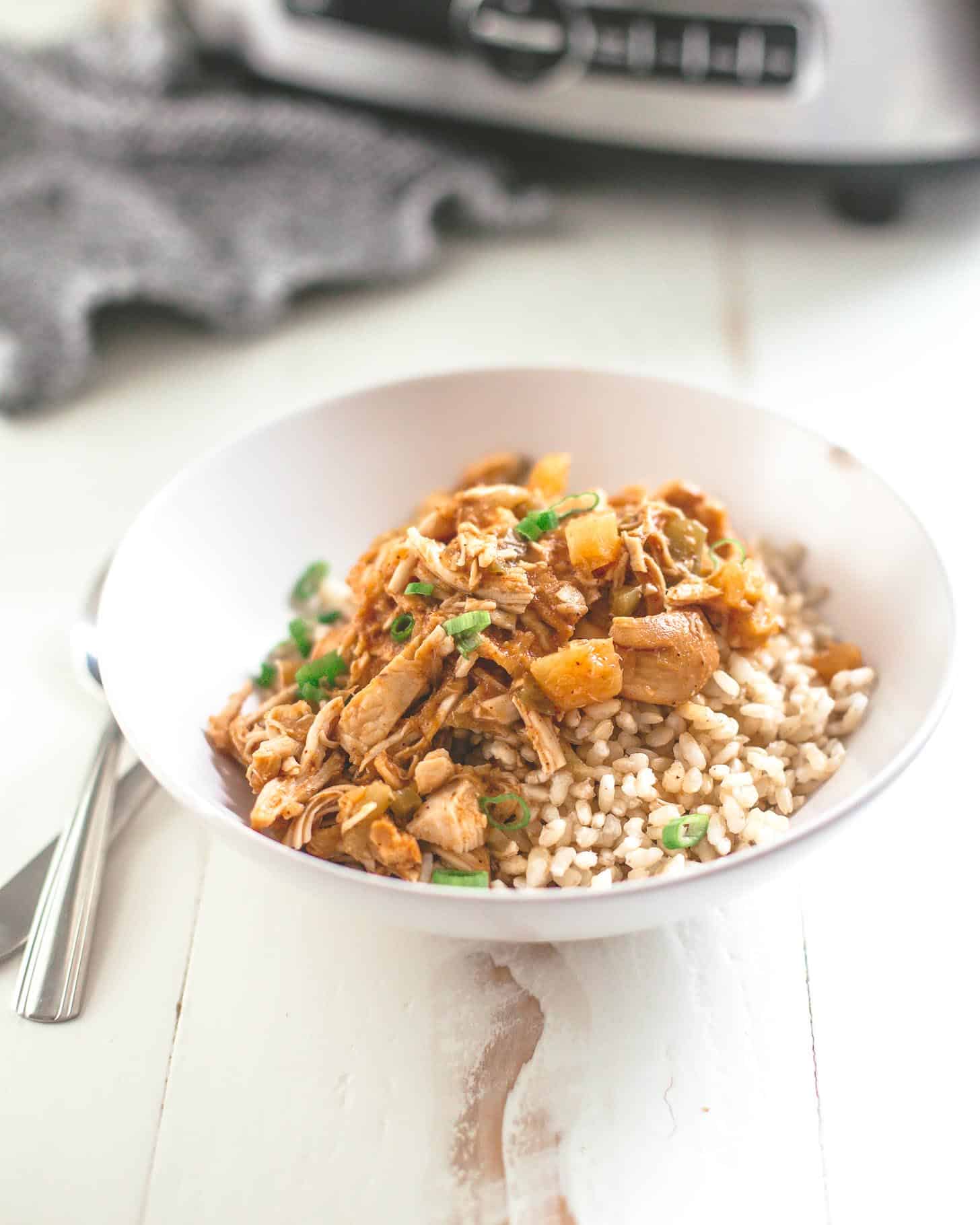 hawaiian chicken in a white bowl over rice