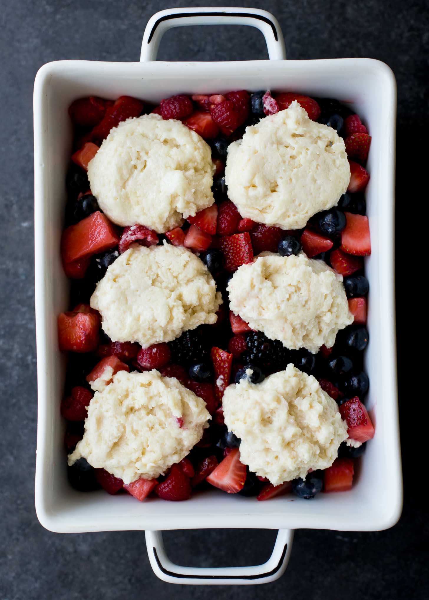 summer berry cobbler with drop biscuits on top