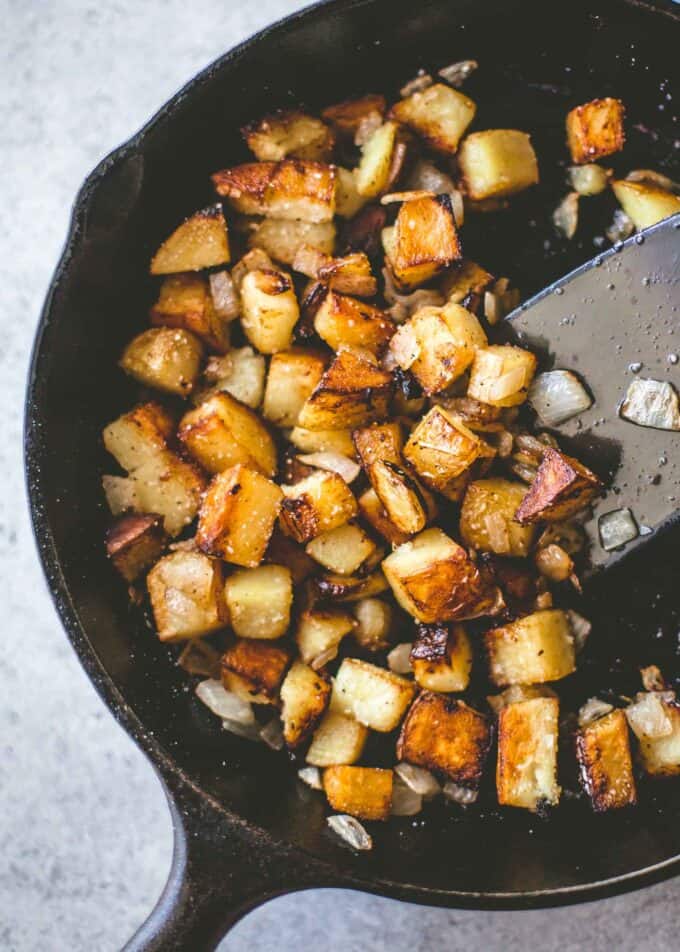 cooking potatoes in a cast iron skillet