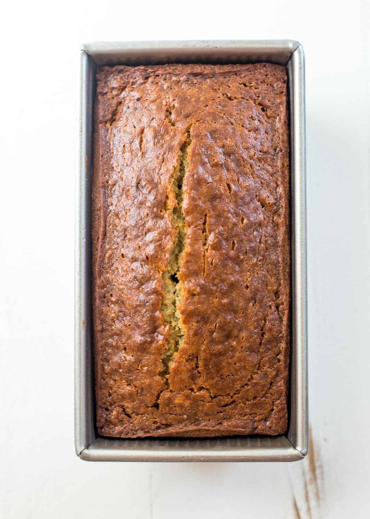 overhead image of banana bread in a loaf pan