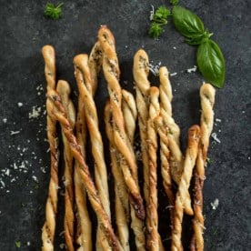 baked breadsticks on a grey countertop