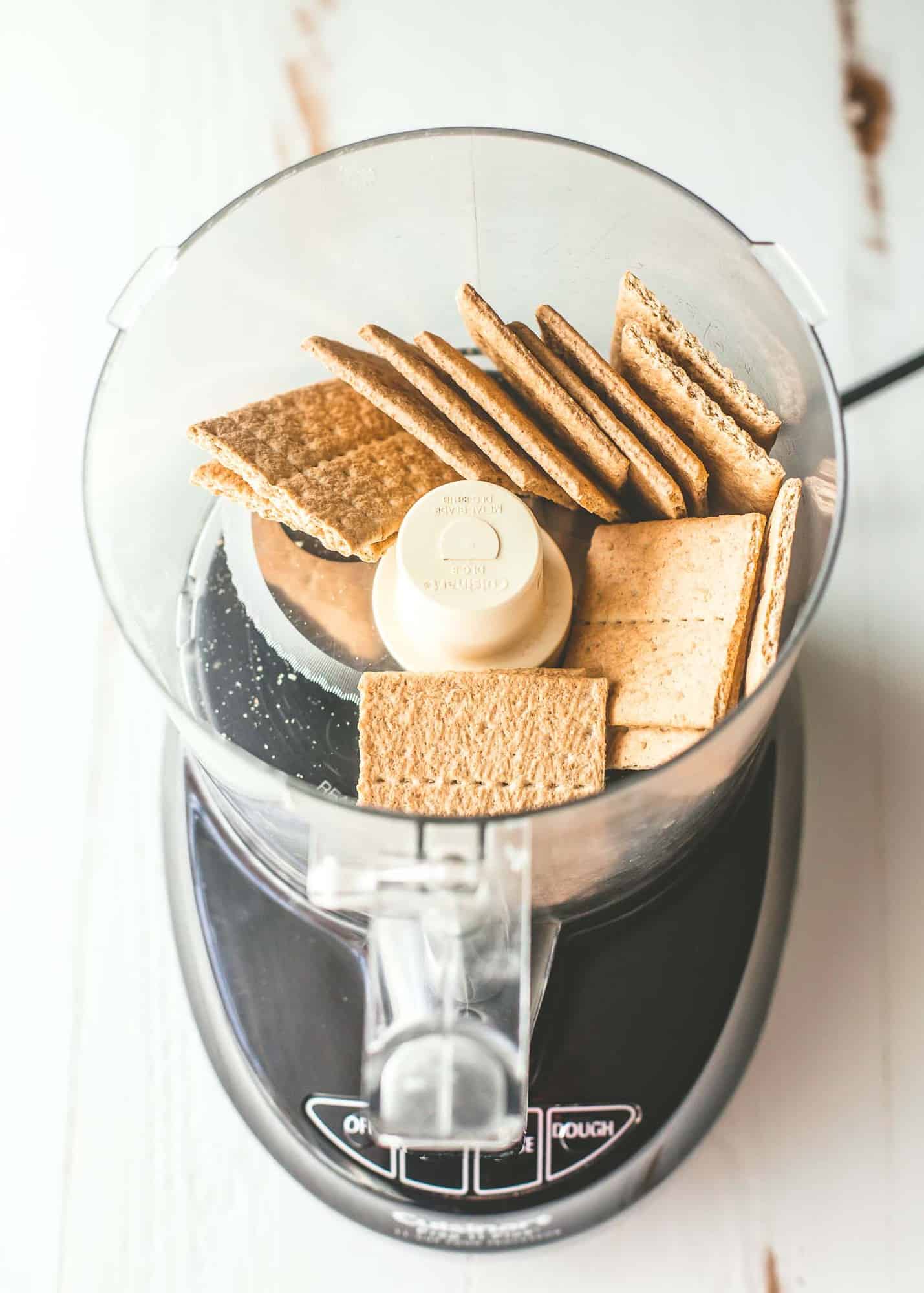 overhead image of whole graham crackers in a food processor