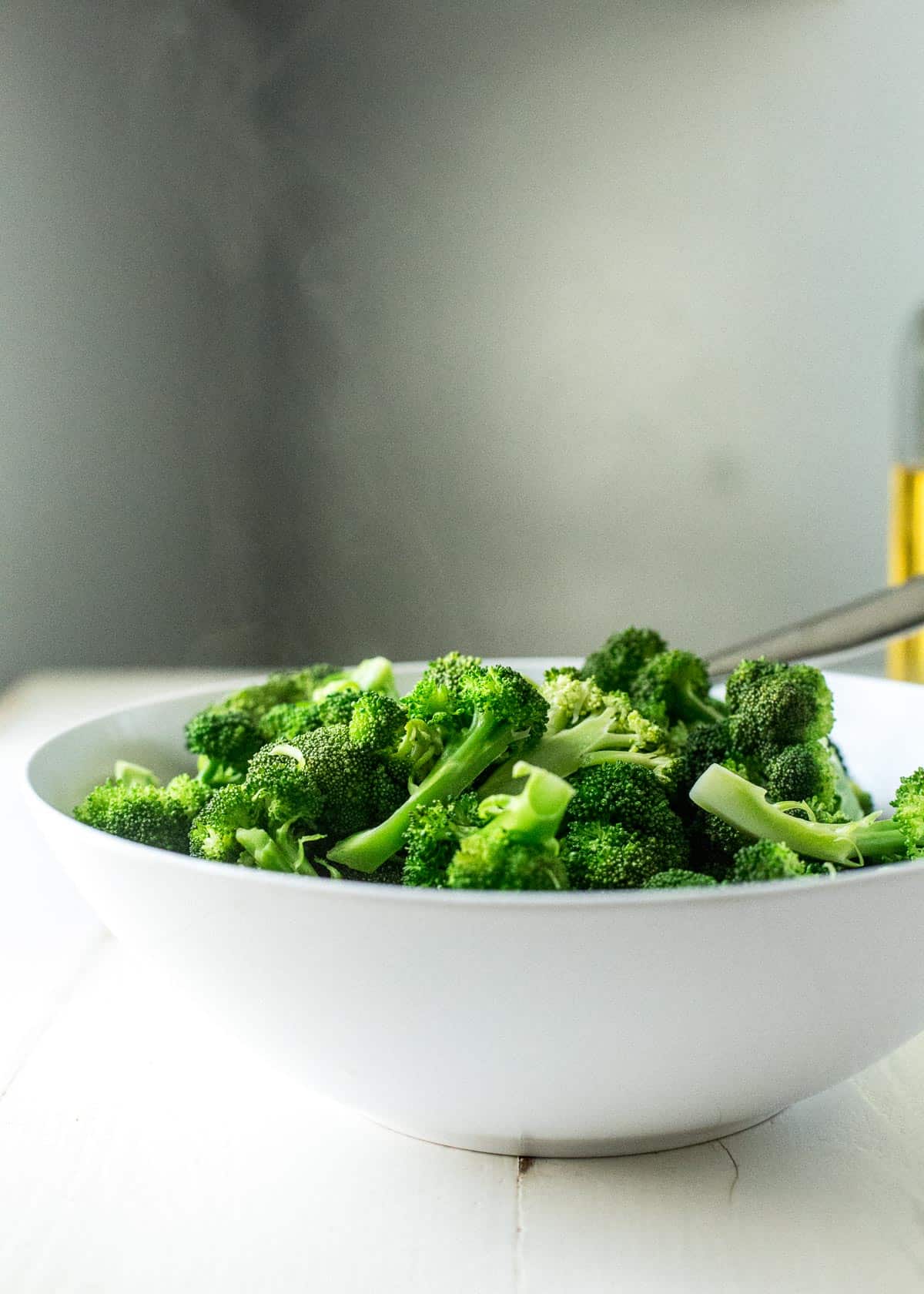 steamed broccoli in a white bowl