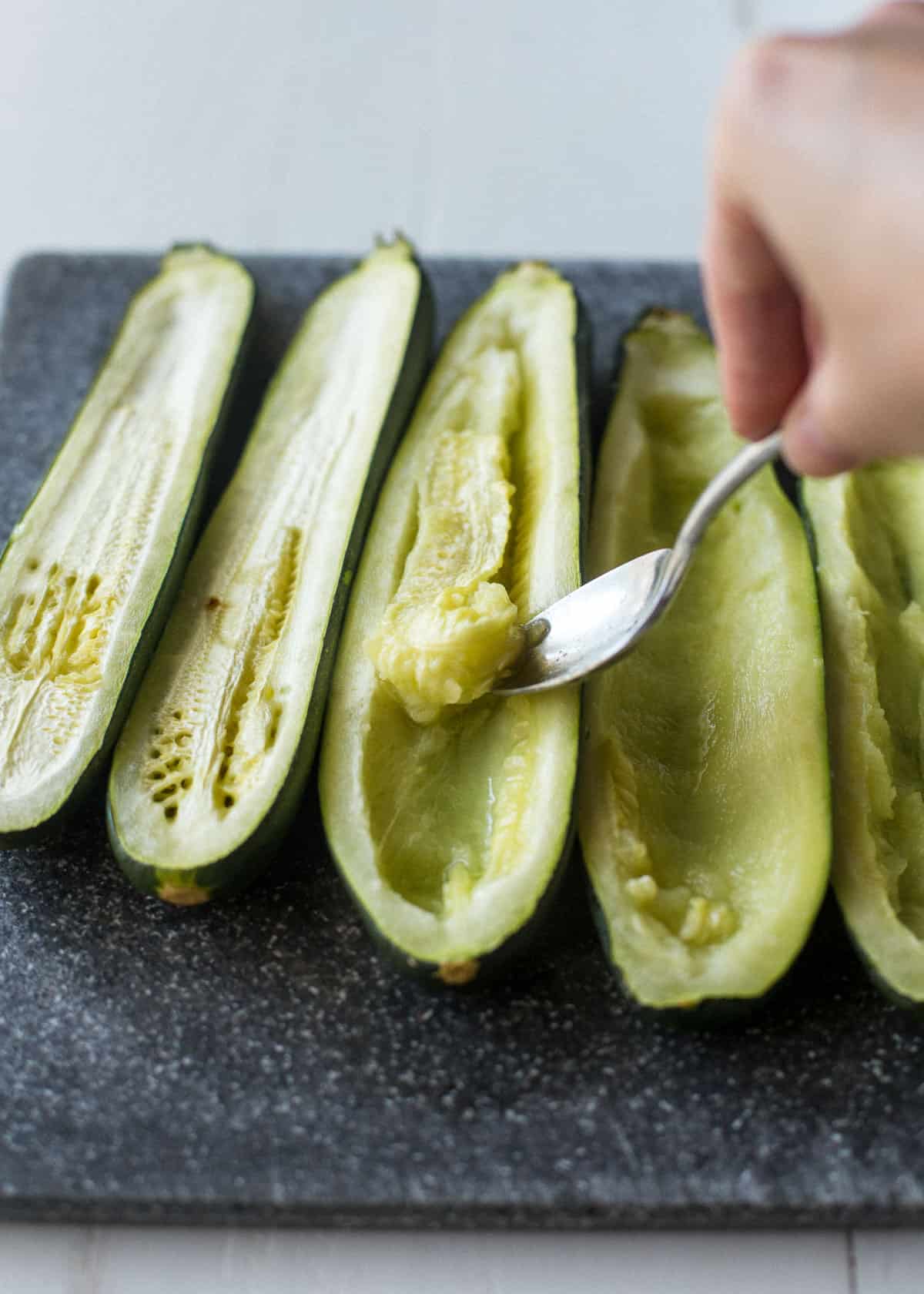 cooked zucchini cut in half