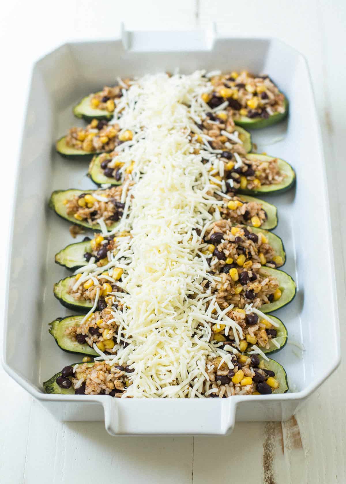 uncooked zucchini topped with cheese