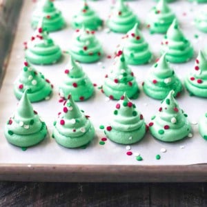 christmas tree meringues on a parchment lined sheet pan