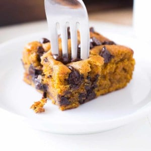 pumpkin chocolate cake with a fork in it