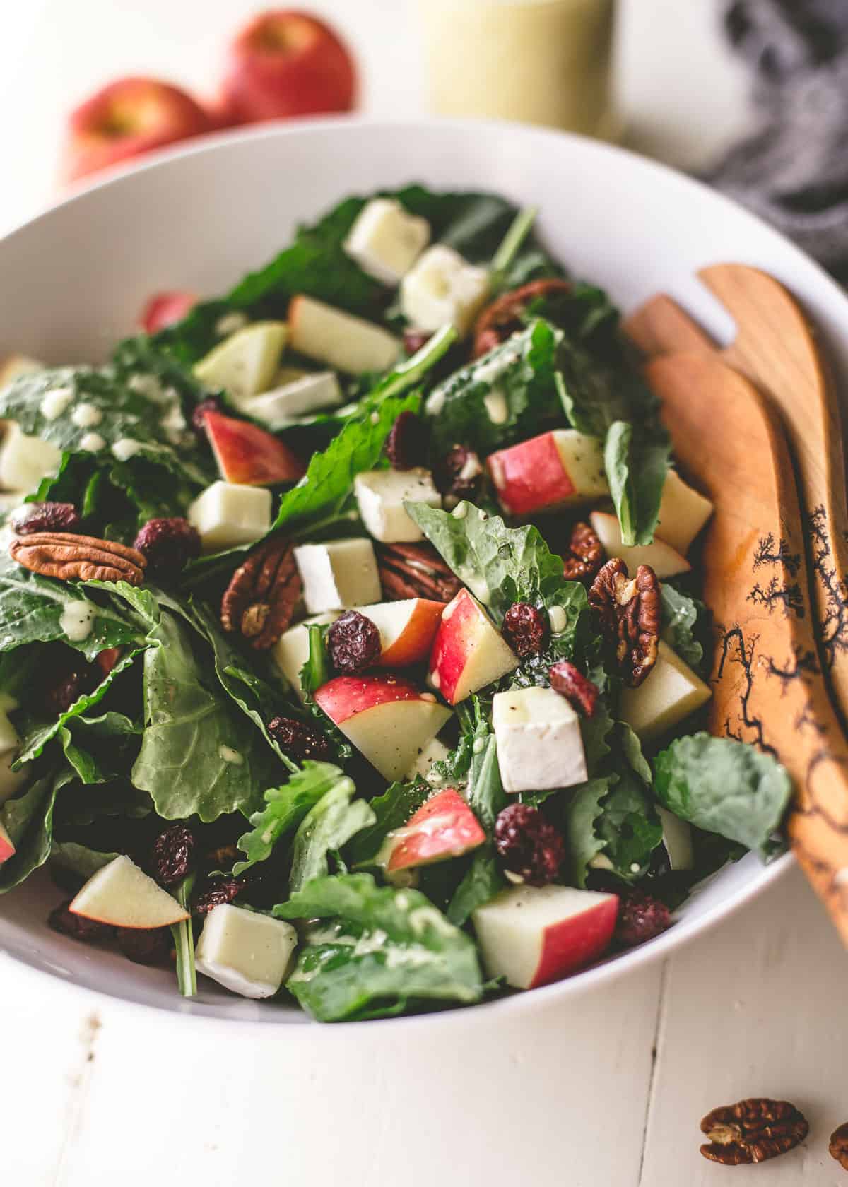 apple, brie and pecan salad in a white bowl