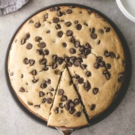 chocolate chip ricotta cake in a round baking pan