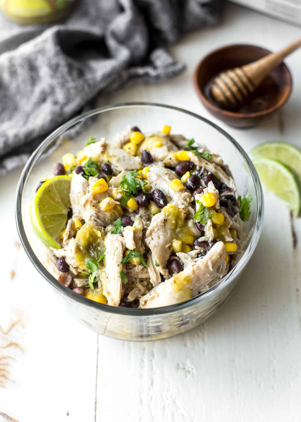 green salsa chicken in a clear bowl