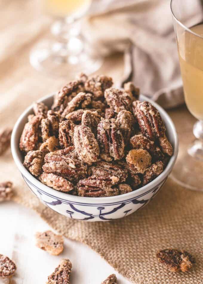 candied pecans in a blue and white bowl