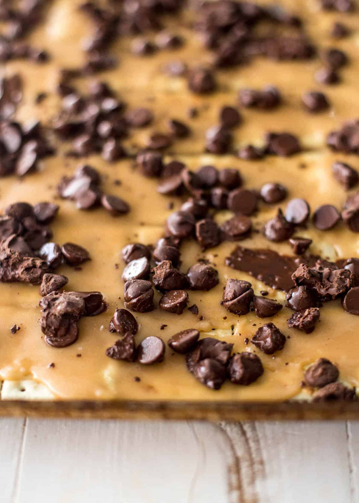 adding chocolate chips to toffee