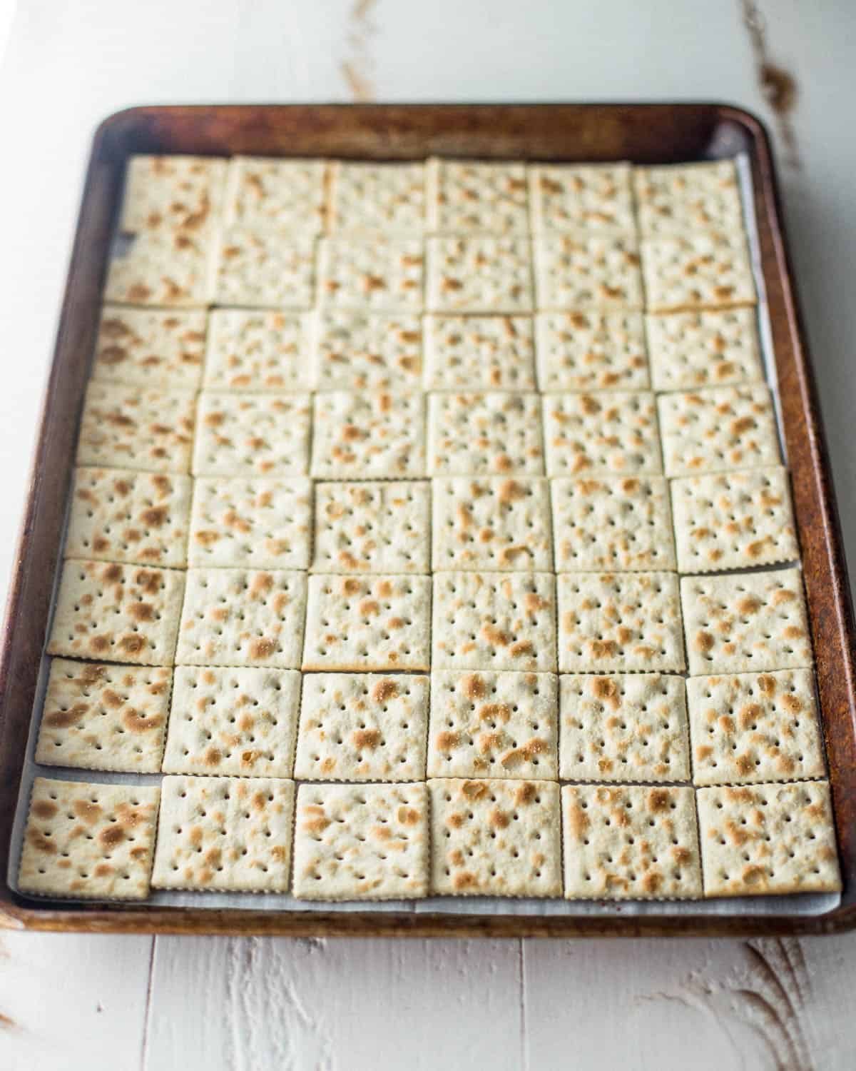 saltine crackers on a sheet pan