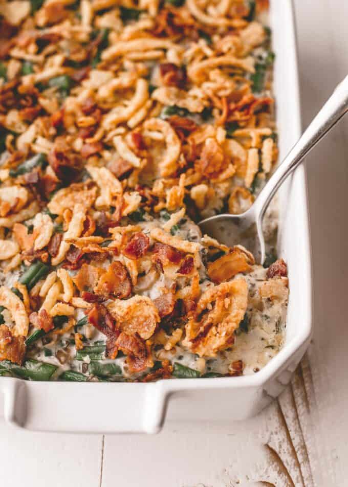 a spoon in cooked green bean casserole
