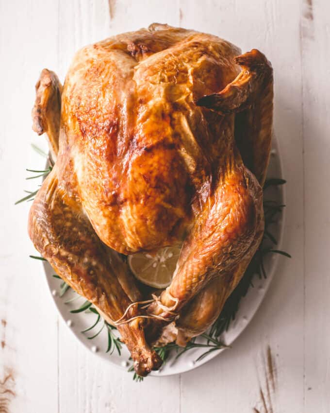 a roasted turkey on a white tray