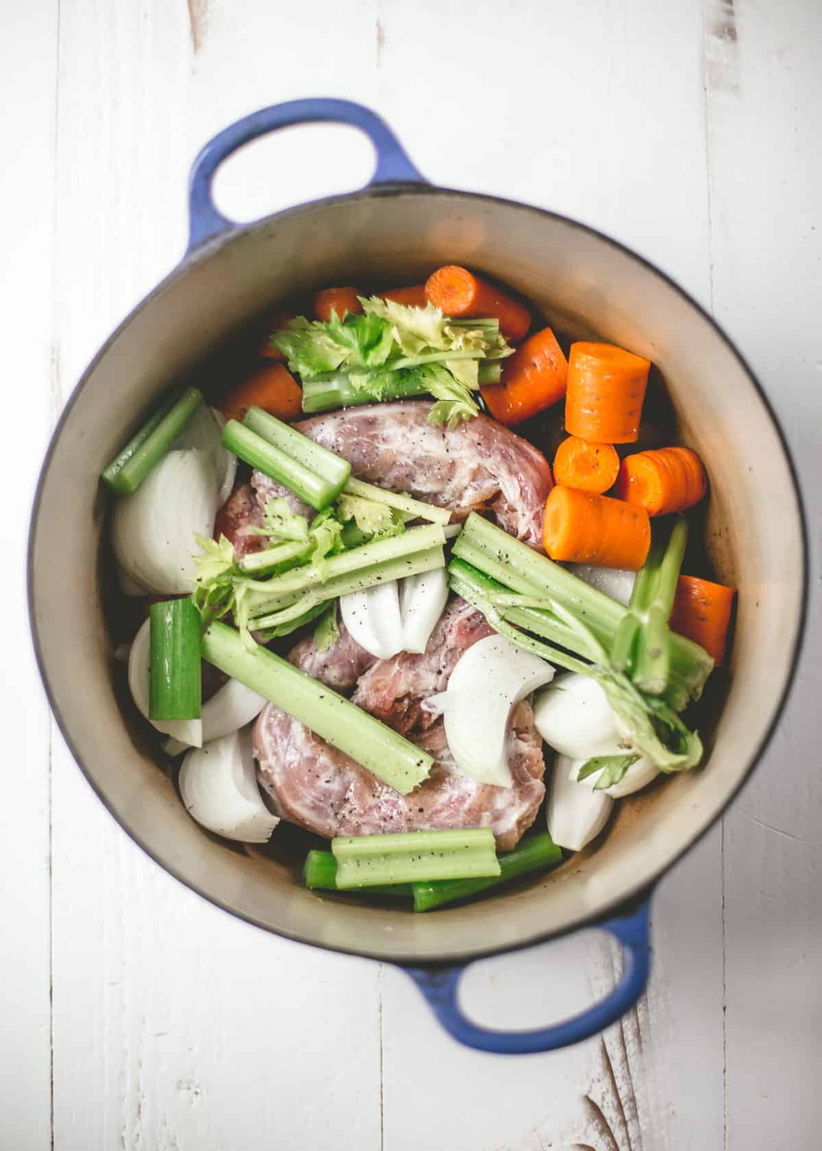 turkey bones and vegetables in a dutch oven