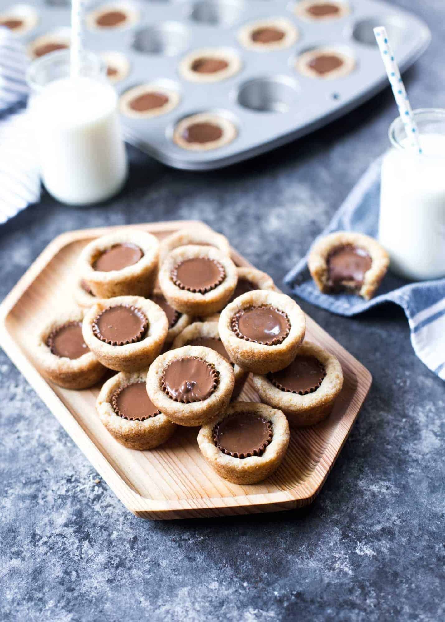 peanut butter cookie cups on a wooden tray