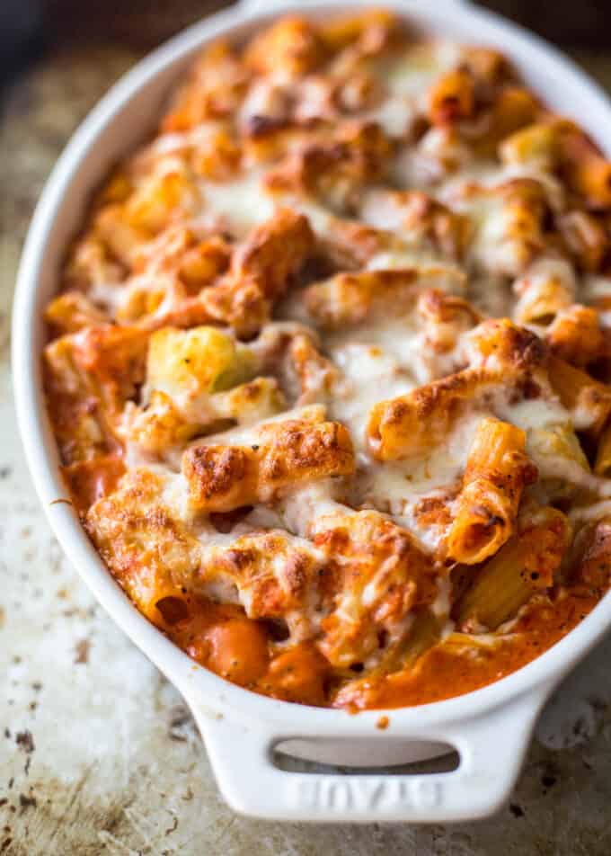 baked ziti in a white oval baking dish