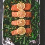 salmon filets on a bed of greens and chickpeas