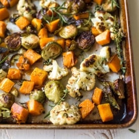 herb roasted vegetables on a sheet pan