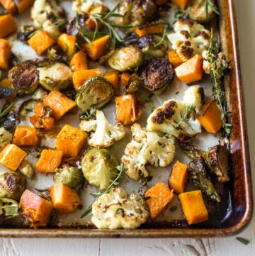 herb roasted vegetables on a sheet pan