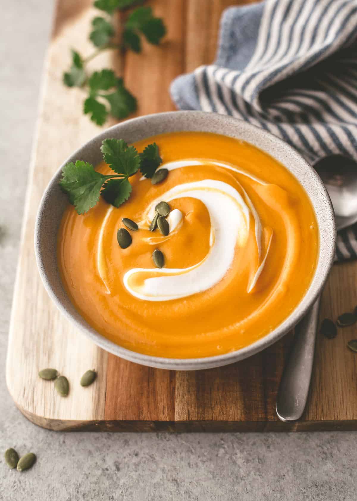 butternut squash soup in a white bowl